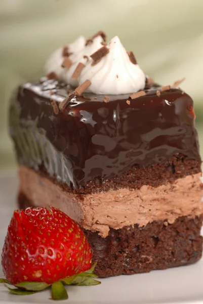 Chocolate mousse cake with whipped cream and strawberry — Stock Photo, Image