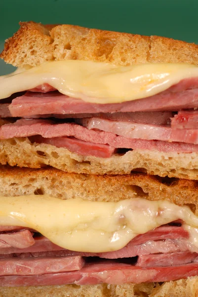 Closeup of corned beef sandwich with cheese on rye — Stock Photo, Image