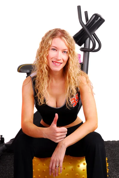 Young woman giving thumbs up after workout — Stock Photo, Image