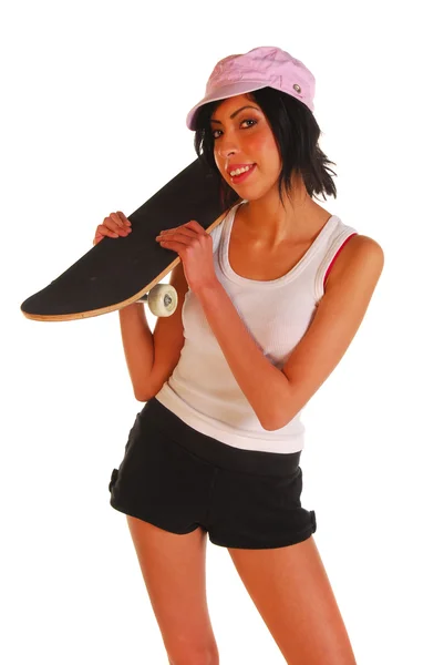 एक युवा महिला एक स्केटबोर्ड पकड़े हुए — स्टॉक फ़ोटो, इमेज