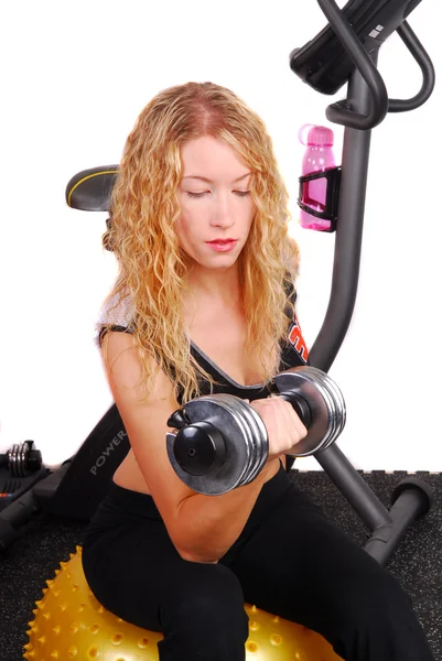 Attractive woman lifting dumb bell — Stock Photo, Image