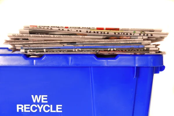 stock image Recycling bin with newspapers