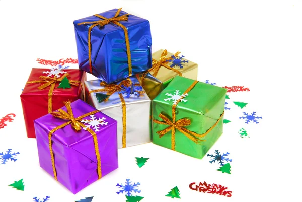 Several brightly colored Christmas gifts — Stock Photo, Image