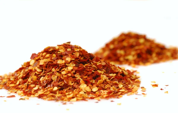 Heaps of red pepper flakes — Stock Photo, Image