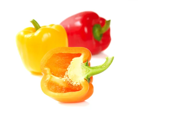 Orange, yellow and red bell peppers — Stock Photo, Image
