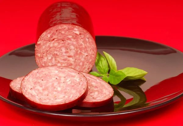 Cured salami with basil — Stock Photo, Image