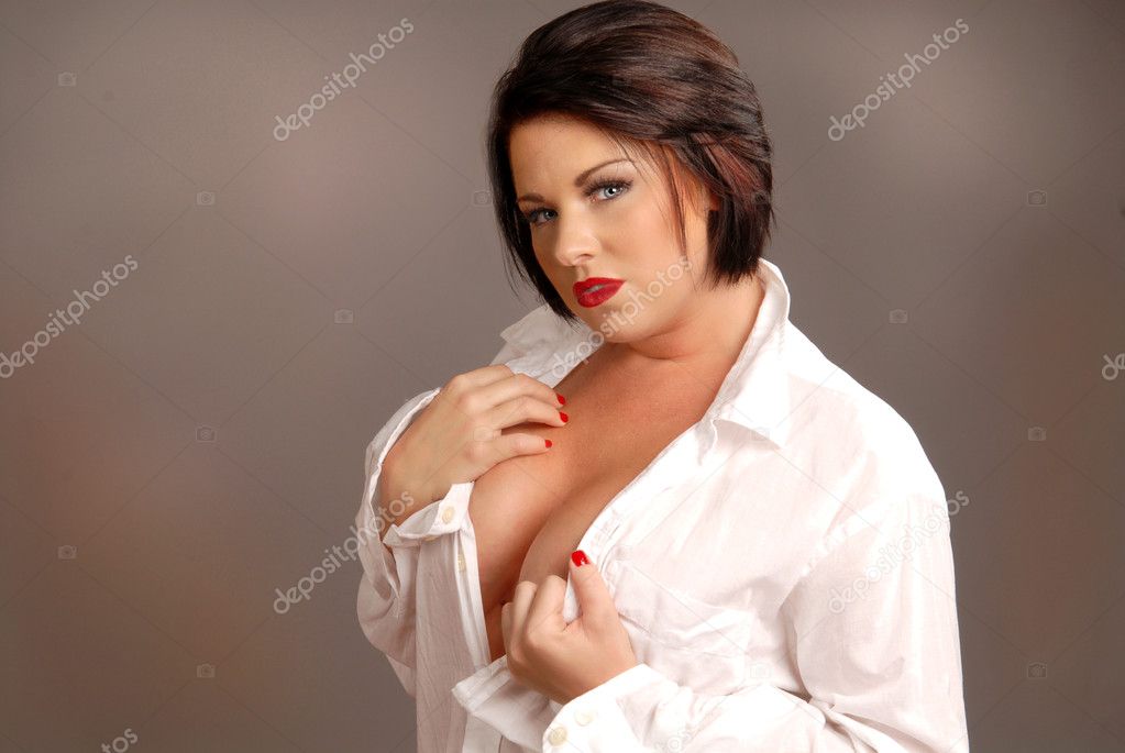 Sexy brunette woman wearing an open white shirt