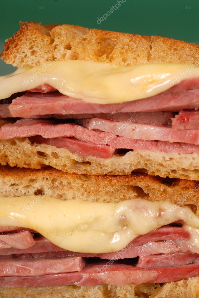 Closeup of corned beef sandwich with cheese on rye — Stock Photo