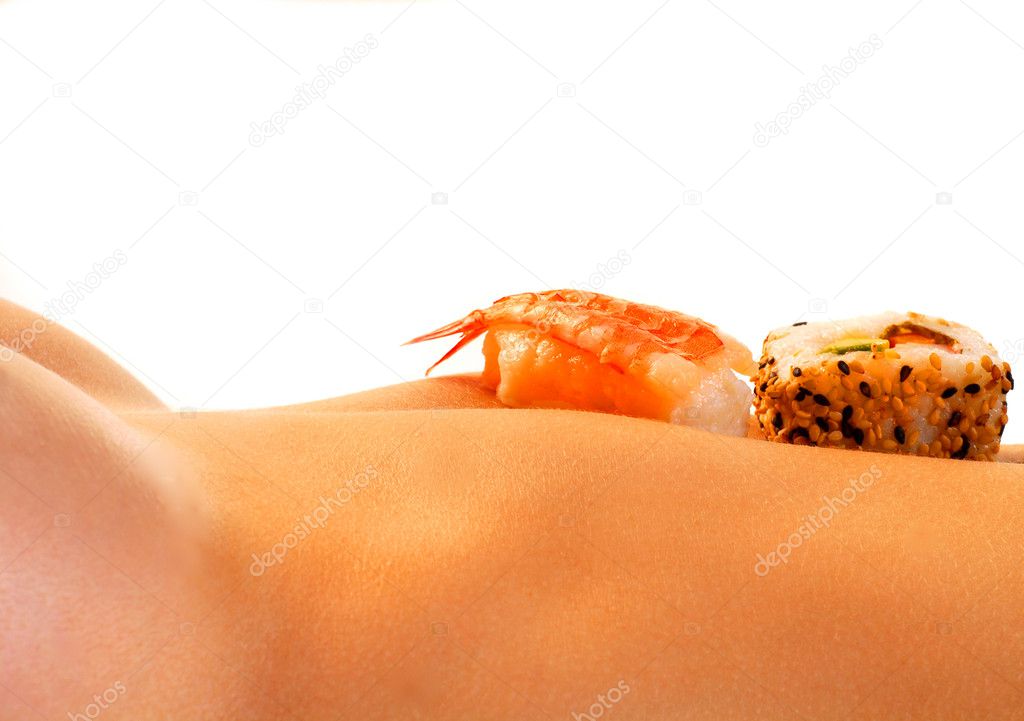 Sushi on the stomach of a nude woman