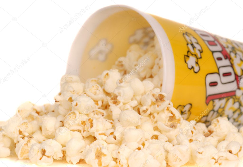 Container of popcorn with popcorn spilling out