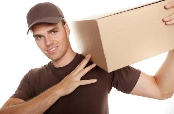 Uomo di consegna con pacchetto Fotografia Stock