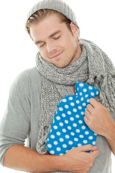 Hombre con almohadilla de calefacción sonriendo —  Fotos de Stock