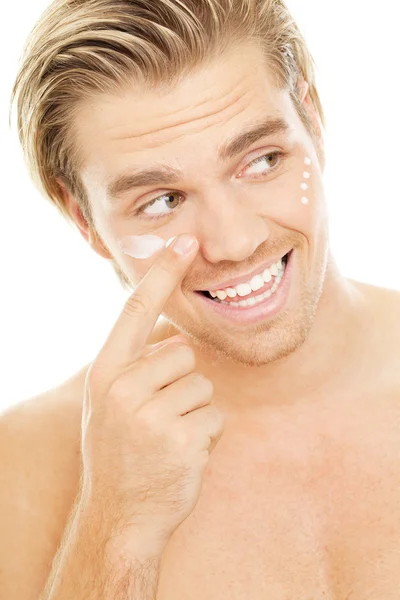 Goodlooking blond man with creme — Stock Photo, Image