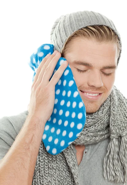 Man with heating pad Royalty Free Stock Photos