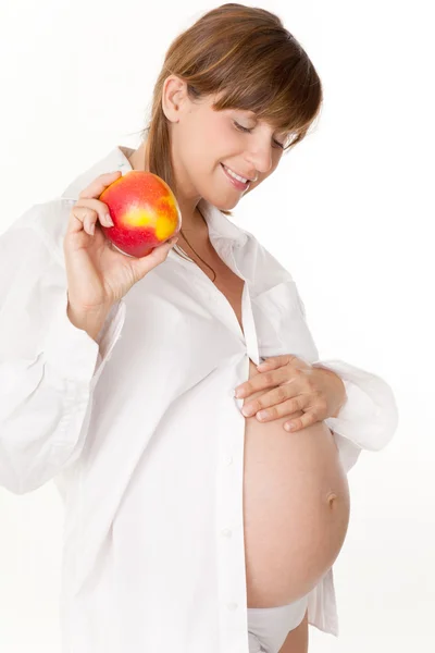 Pregnant woman taking care of food — Stock Photo, Image