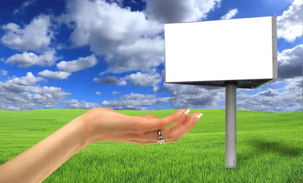 Blank billboard in beautiful landscape scenery with women hand — Stock Photo, Image