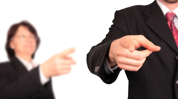 Businessman pointing with blur boss on background — Stock fotografie