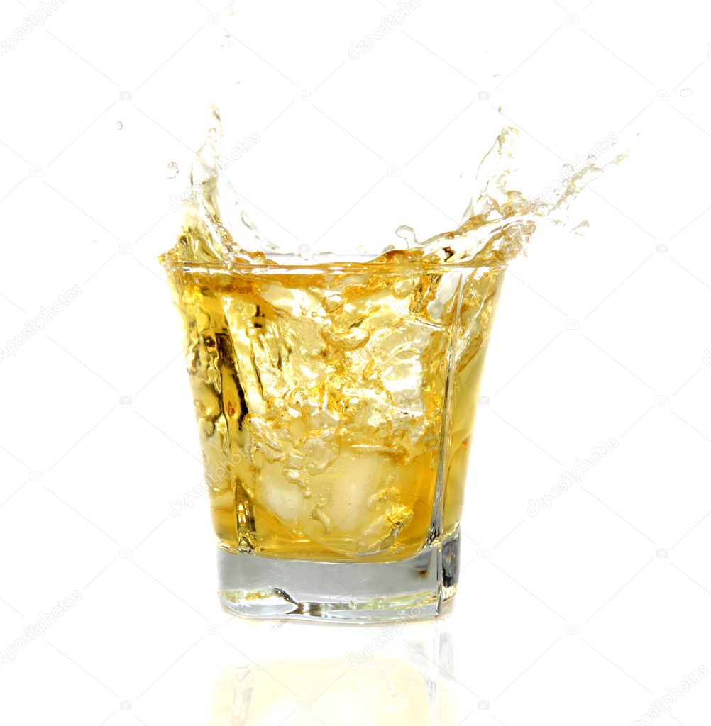 Glass with Whiskey splashing out
