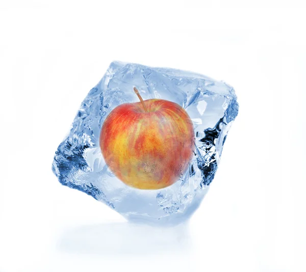 Red apple frozen in ice cube — Stock Photo, Image