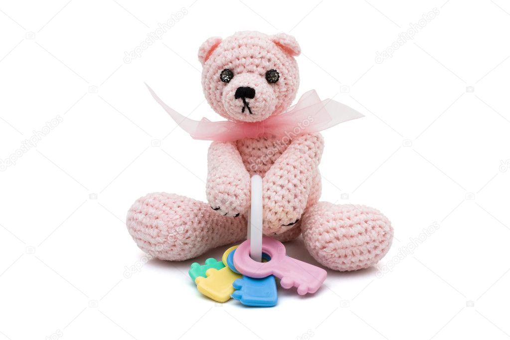 Cute homemade teddy bear with baby rattle