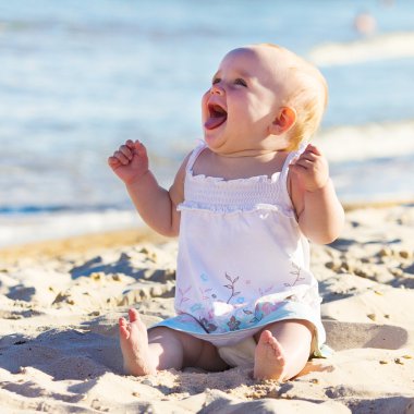 Baby on a beach clipart