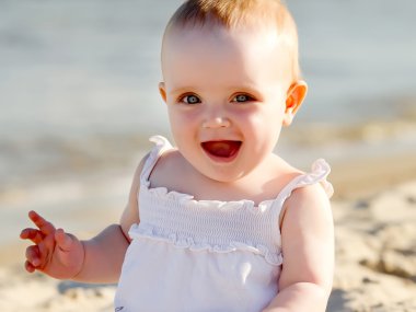 Baby on a beach clipart