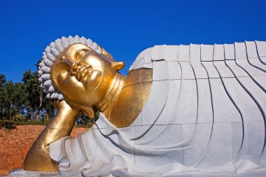 Statue of Buddha lying down clipart