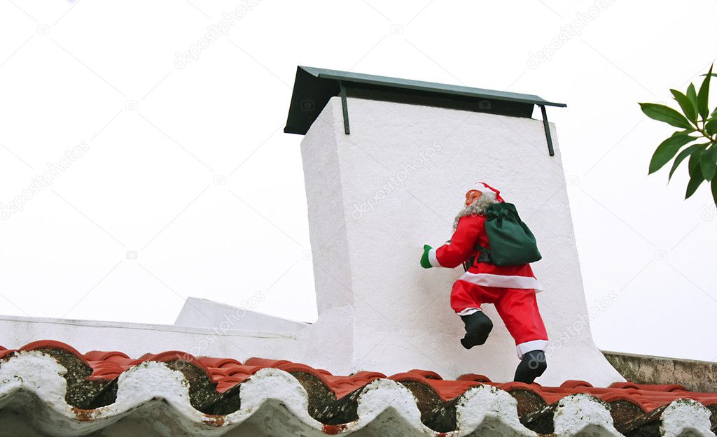 Santa Claus climbing the chimney