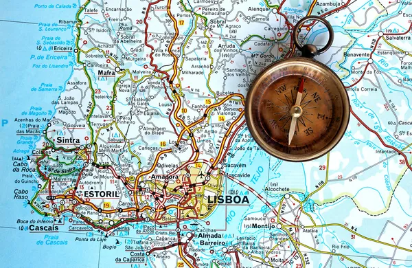 Brass compass in a Lisbon map — Stock Photo, Image