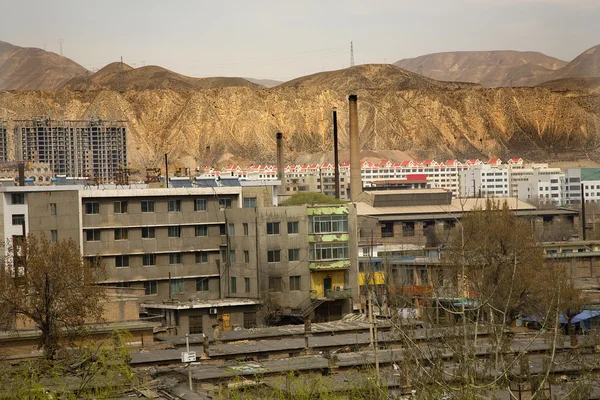 stock image Chinese Factory with Chimneys Apartments Gansu Province, Qinghai