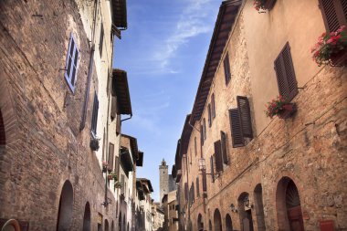 Narrow Street Via San Giovanni San Gimignano Tuscany Italy clipart