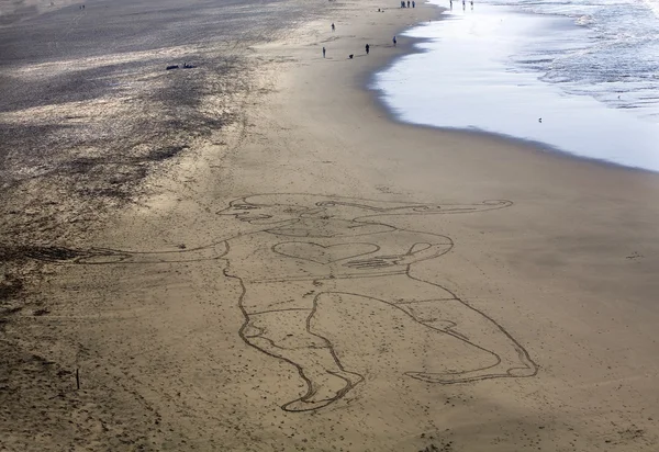 Sand målning kvinna punkt lobos stranden san francisco Kalifornien — Stockfoto