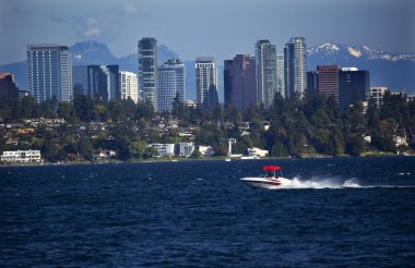 Bellevue Skyline from Lake Washington Speedboat Snow Capped Moun clipart