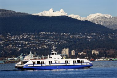 Vancouver Harbor Ferry Snowy Two Lions Mountains British Columbi clipart