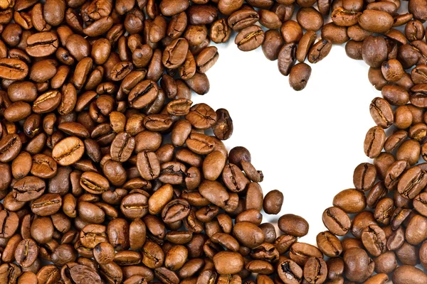 Geröstete Kaffeebohnen und die Form des Herzens. — Stockfoto