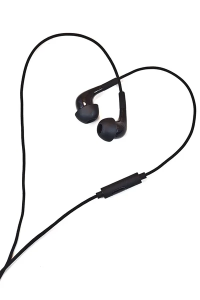 Audio earphones in shape of heart — Stock Photo, Image