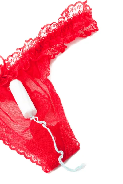 Wanita produk kebersihan feminin pada celana dalam merah — Stok Foto
