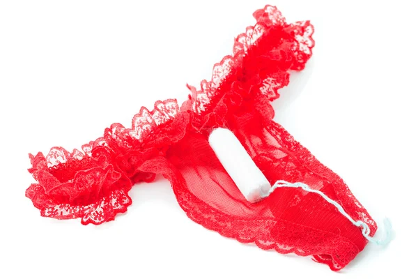 Señoras producto de higiene femenina en bragas rojas — Foto de Stock