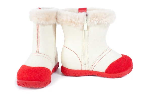 Chaussures en feutre blanc pour enfants avec semelle en caoutchouc rouge isolée — Photo