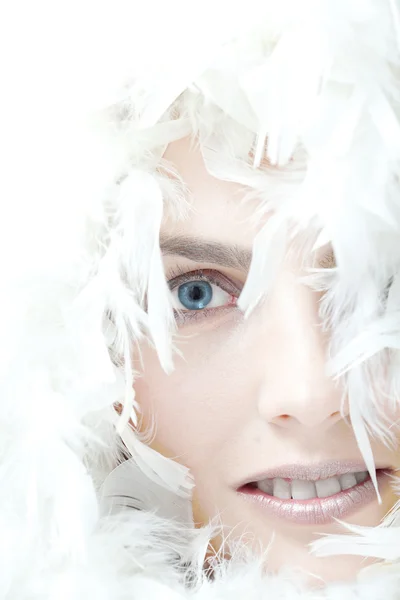Beautiful woman with white feathers — Stock Photo, Image