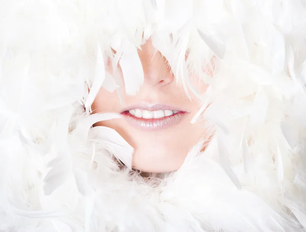 Beautiful woman with white feathers — Stock Photo, Image