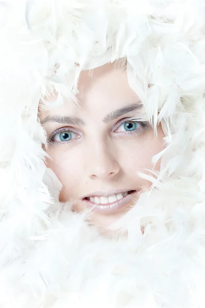 Beautiful woman with white feathers Stock Picture