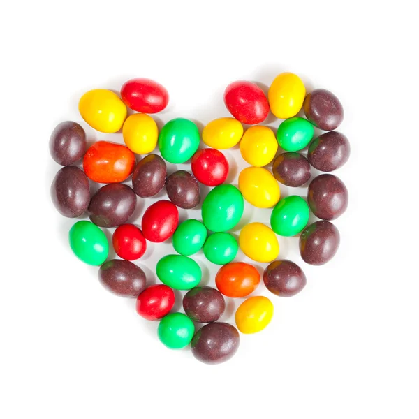 Группа цветных сладких сахарных конфет в сочетании с сердцем — стоковое фото