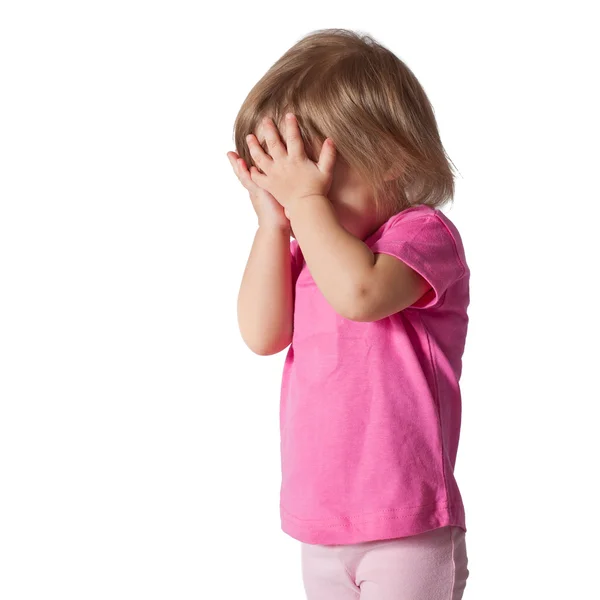 Girl with hands covering eyes playing hide and seek — Stock Photo, Image