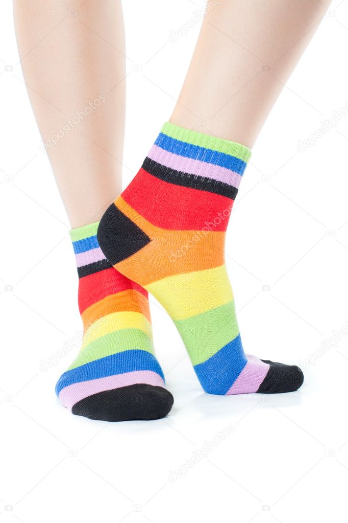 Foots in stripped socks over white