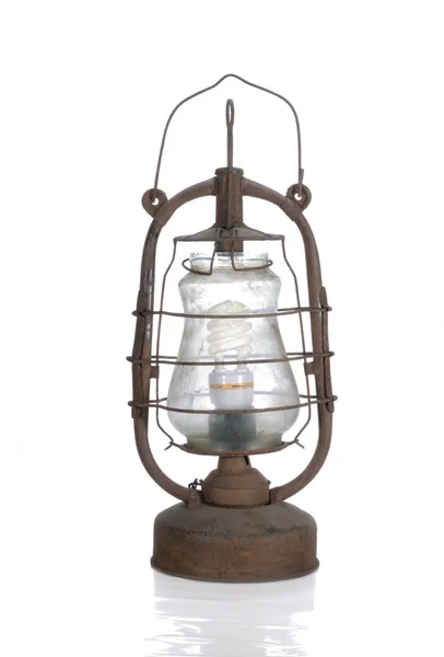 stock image Dirty kerosene lamp with modern bulb isolated