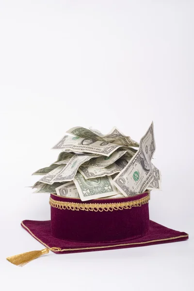 Master's cap with a dollars — Stock Photo, Image
