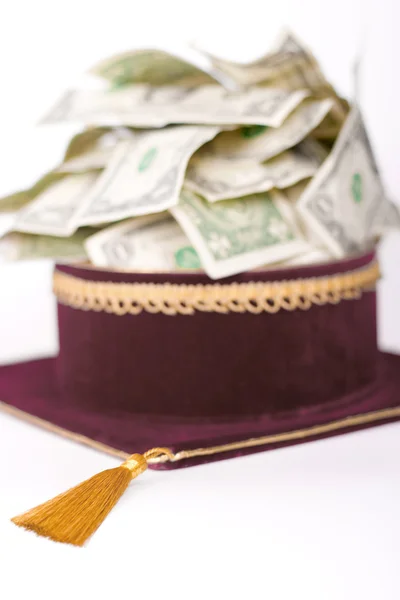 Master's cap with a dollars — Stock Photo, Image