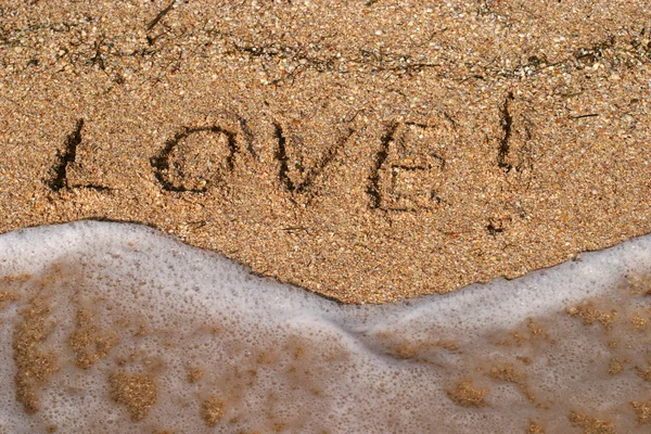 Love inscriptions on the beach — Stock Photo, Image