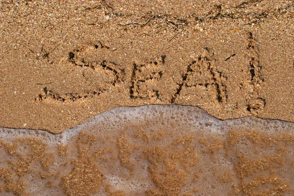 Inscriptions on the sand — Stock Photo, Image
